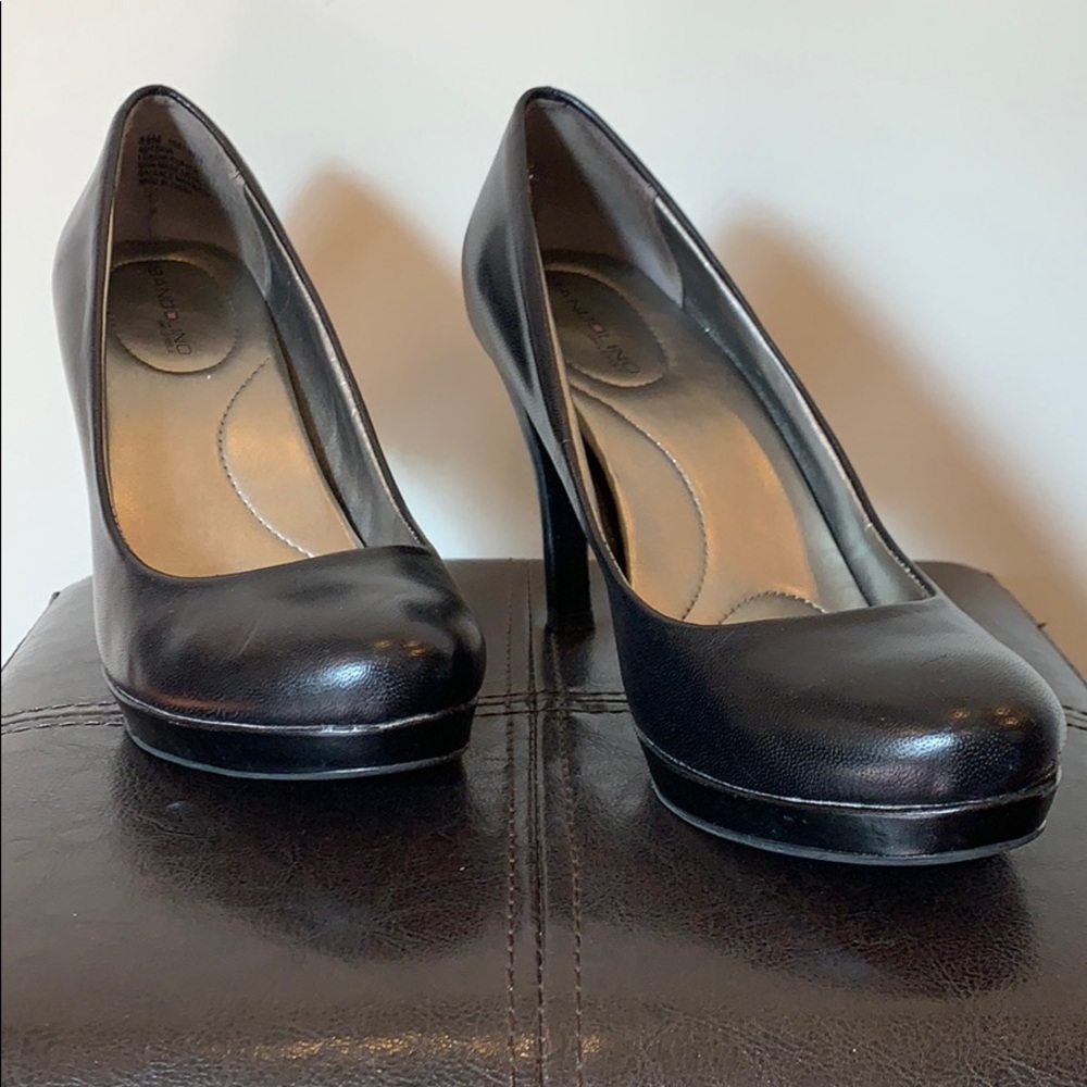 Black heels with small platform.